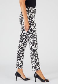 Damart Pantaloni - noir feuillage