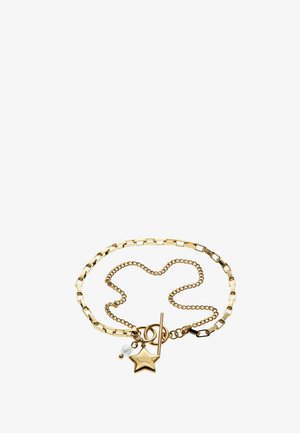 Bracelet en chaîne dorée composé d'un mélange de maillons plats et ronds, avec un pendentif en forme d'étoile, une perle et un fermoir T-bar.