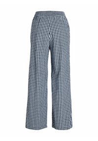 Pantalons à jambes larges en vichy noir et blanc avec une taille élastique. Fabriqués en tissu léger, offrant une coupe décontractée et une texture lisse.