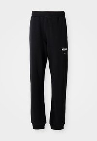 MILANO - Tracksuit bottoms - black