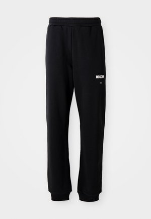 Black sweatpants with a relaxed fit, made of soft fabric. Features an elastic waistband and white "Moschino" logo on the left thigh.