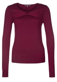 Maglione bordeaux con maniche lunghe, scollo rotondo e dettaglio a fiocco sul petto. Realizzato in tessuto morbido e elasticizzato con una silhouette aderente.