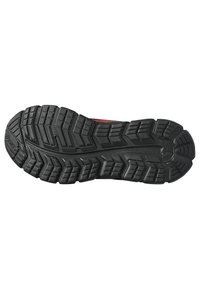 Semelle de chaussure en caoutchouc noir avec des rainures et motifs profonds pour l'adhérence, présentant une zone surélevée lisse près du talon et un design durable et flexible.