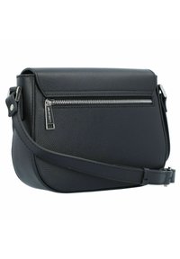 Black leather crossbody bag with a textured finish, featuring a front zipper pocket, adjustable strap, and sleek curved shape.