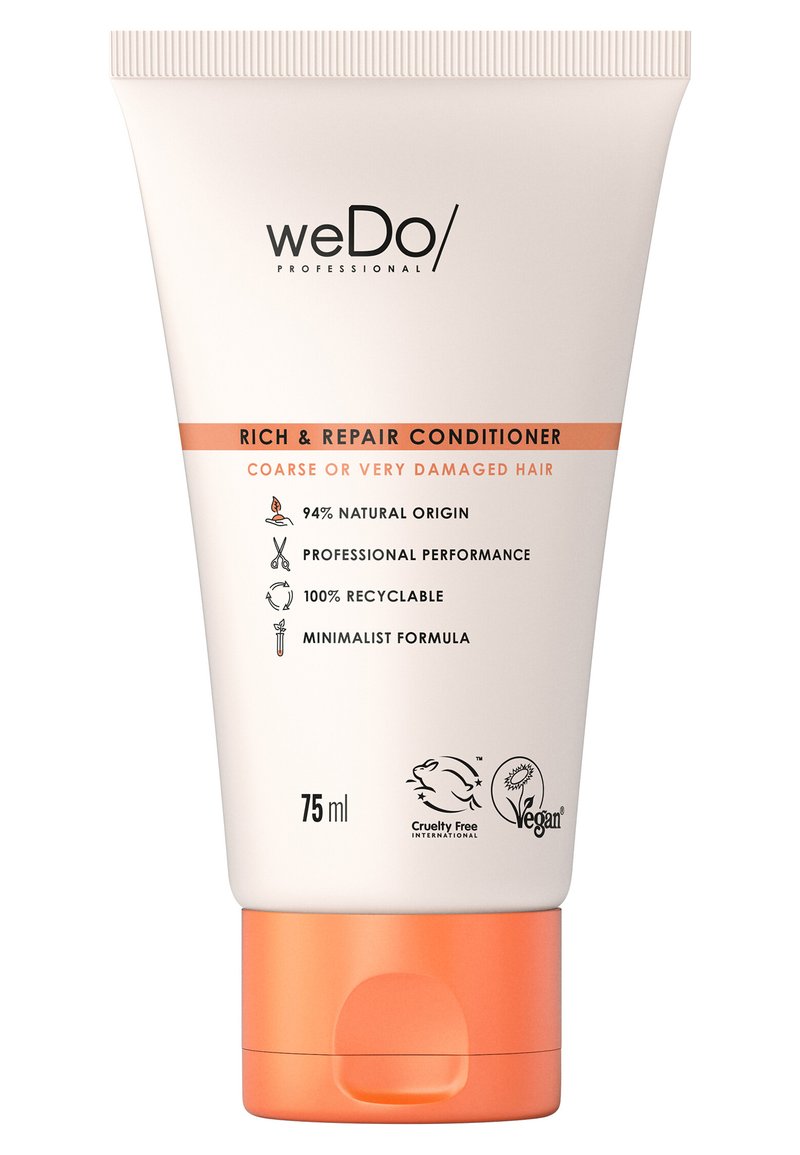 75 ml witte knijpfles met een oranje basis, met tekst die "Rich & Repair Conditioner" voor beschadigd haar aangeeft en ecovriendelijke iconen.