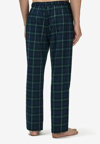 Miestne pyžamové nohavice v námorníckej modrej kocke s zelenými a bielymi detailmi, elastický pás, dlhé rovné nohy, bavlnený materiál a jemná textura.