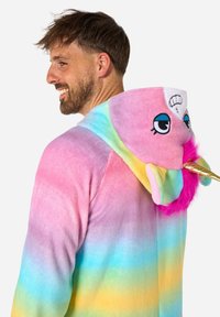 Rainbow-hued hoodie in soft fleece. Features a unicorn hood with eyes, a gold horn, and pink fur accents for a playful design.
