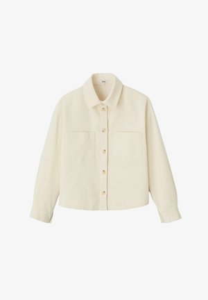 Veste chemise en velours côtelé de couleur crème avec un col, fermeture à boutons à l'avant, deux poches poitrine et manches longues. Finition en tissu texturé.