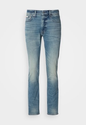 Light blue denim jeans featuring a straight cut, five-pocket design, and slight fading. Button and zipper closure at the waist.
