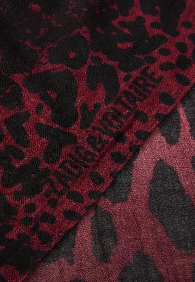 Black and burgundy animal print scarf featuring a soft texture and a distinct logo of "Zadig & Voltaire" at the edge.
