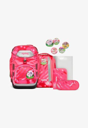 Pink ergonomic backpack with a shiny finish, curved design, striped patterns, and animal-themed badges, accompanied by an organizer and pencil case.