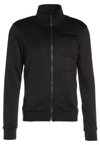 Schwarze Jacke mit hohem Kragen, durchgehendem Reißverschluss, zwei Vordertaschen und einer Brusttasche. Glattes Material mit taillierter Passform.