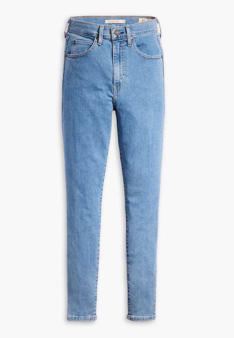 Jean en denim bleu clair avec une coupe slim, design classique à cinq poches, fermeture éclair et détails de couture contrastés.
