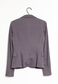 Mönstrad kavaj i brunt, med en geometrisk design i blått och vitt, långärmad och med slagkrage. Två sidofickor ingår.