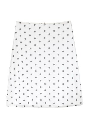 Jupe trapèze blanche avec des pois noirs uniformément espacés et un petit nœud à la taille.