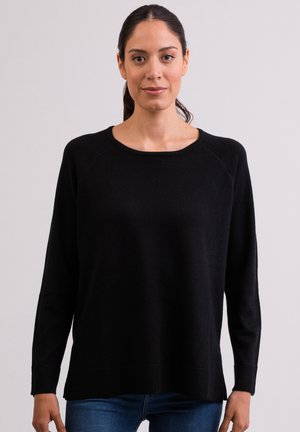 Maglione nero con scollo rotondo, maniche lunghe a raglan, orlo a coste e vestibilità comoda. Texture morbida, realizzato in materiale a maglia.
