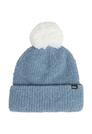 Gorro de punto azul con un patrón texturizado, que presenta un dobladillo enrollado y un pompón blanco en la parte superior. Incluye una pequeña etiqueta de logo negra.