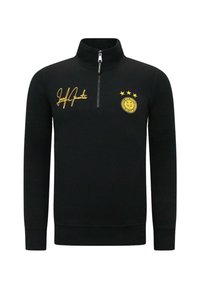 Zwarte rits sweatshirt met gele accenten, voorzien van een handtekening, logo en drie sterren. Gemaakt van een zachte stof, met lange mouwen.