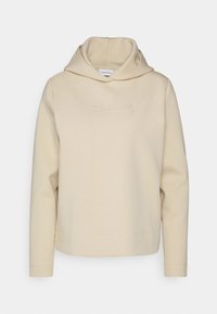 Beige mikina z měkké tkaniny. Obsahuje přední klokaní kapsu, žebrované manžety a vyšívané logo na hrudi. Nastavitelná kapuce.