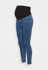 Těhotenské skinny džíny s černým elastickým panelem přes bříško a modrou denimovou tkaninou s jemným prošíváním. Klasický design s pěti kapsami.