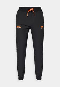 UFC ZENITH FIGHT WEEK MENS JOGGER  - Outdoorové nohavice - black/orange