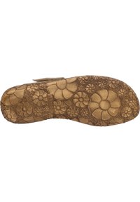 Braune Gummisohle mit floralem Muster, die erhabene Blumen und Texturen aufweist. Das Profildesign ist kompliziert und sorgt für Grip und Stil.