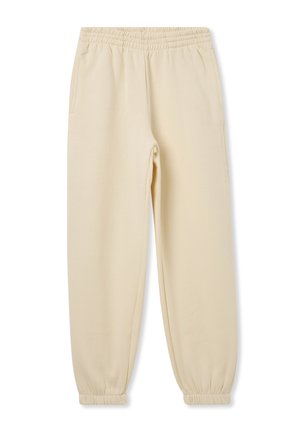 Pantaloni jogger beige realizzati in tessuto morbido, con vita elasticizzata, due tasche laterali e polsini affusolati alle caviglie.