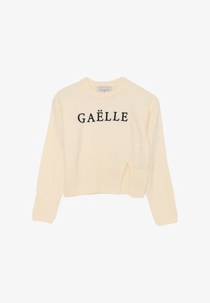 Maglione cropped color crema in materiale testurizzato, con collo rotondo e lettering nero "GAËLLE" sulla parte frontale.