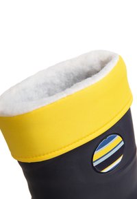 Žltý obojok s mäkkou podšívkou a čiernym telom. Obsahuje okrúhly logo s modrými a žltými pruhmi. Vyrobené z odolného materiálu.