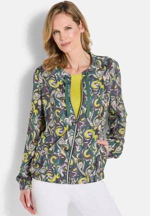Giacca multicolore con zip frontale, caratterizzata da motivi vorticosi in verde, giallo e viola, con scollatura arrotondata e polsini elasticizzati.