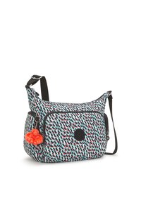 Crossbody bag in patterned fabric featuring shades of blue, red, and black. Includes a front zip pocket and a red monkey keychain charm.