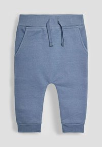 Pantaloni della tuta blu in cotone con vita elasticizzata, coulisse, tasche laterali e orli a costine. Texture morbida e design casual.