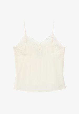 Cami top in cream silk with delicate lace trim along the neckline and straps. Features a fitted shape and smooth texture.