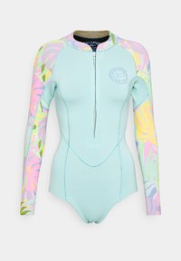 Muta azzurra chiara con maniche lunghe, zip frontale e motivi floreali colorati sulle maniche. Realizzata in materiale elastico per garantire comfort.
