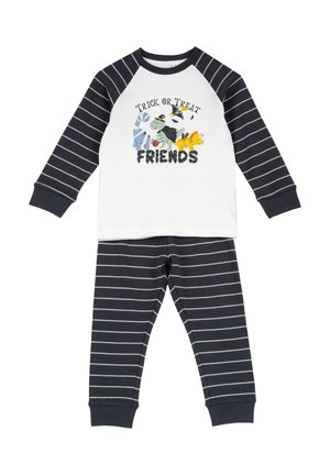 Set pigiama bambino a maniche lunghe con righe nere e bianche e grafica di Halloween "Trick or Treat Friends" con mostri dei cartoni animati sulla maglietta.