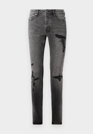Schwarze Denim-Jeans mit Rissdetails, schlankem Schnitt, fünf Taschen und klassischem Reißverschluss. Abgetragenes Aussehen mit verblassten Stellen.