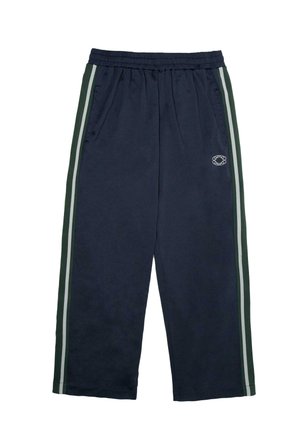 Navy blue track pants with elastic waistband, side pockets, green and white vertical stripes on sides, and small white logo on right thigh.