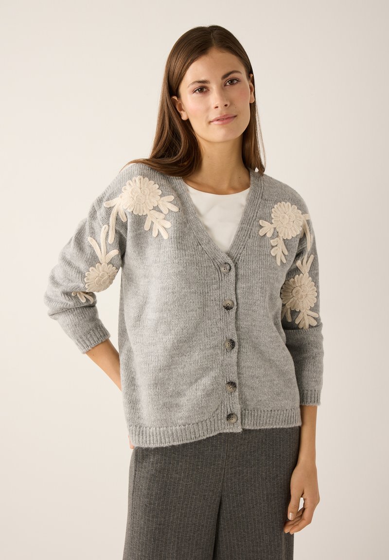 Gray cardigan made of soft knit fabric with a V-neck, featuring beige floral embroidery on the sleeves and five dark buttons down the front.