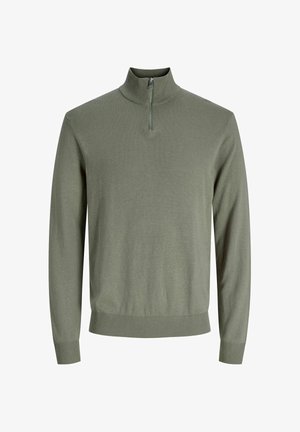 Svijetlozeleni džemper na patentni zatvarač s visokim ovratnikom. Ima duge rukave te rebraste manžete i rub. Glatka tekstura, jednostavan dizajn.