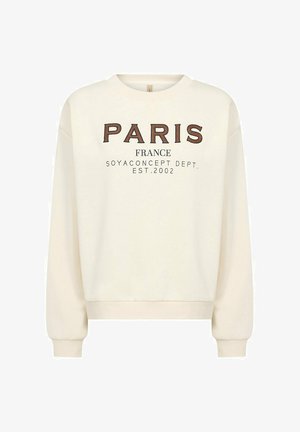 Crèmekleurige trui met de tekst "PARIS FRANCE" in bruine en zwarte letters, met geribbelde boorden en zoom, gemaakt van een zachte stof.