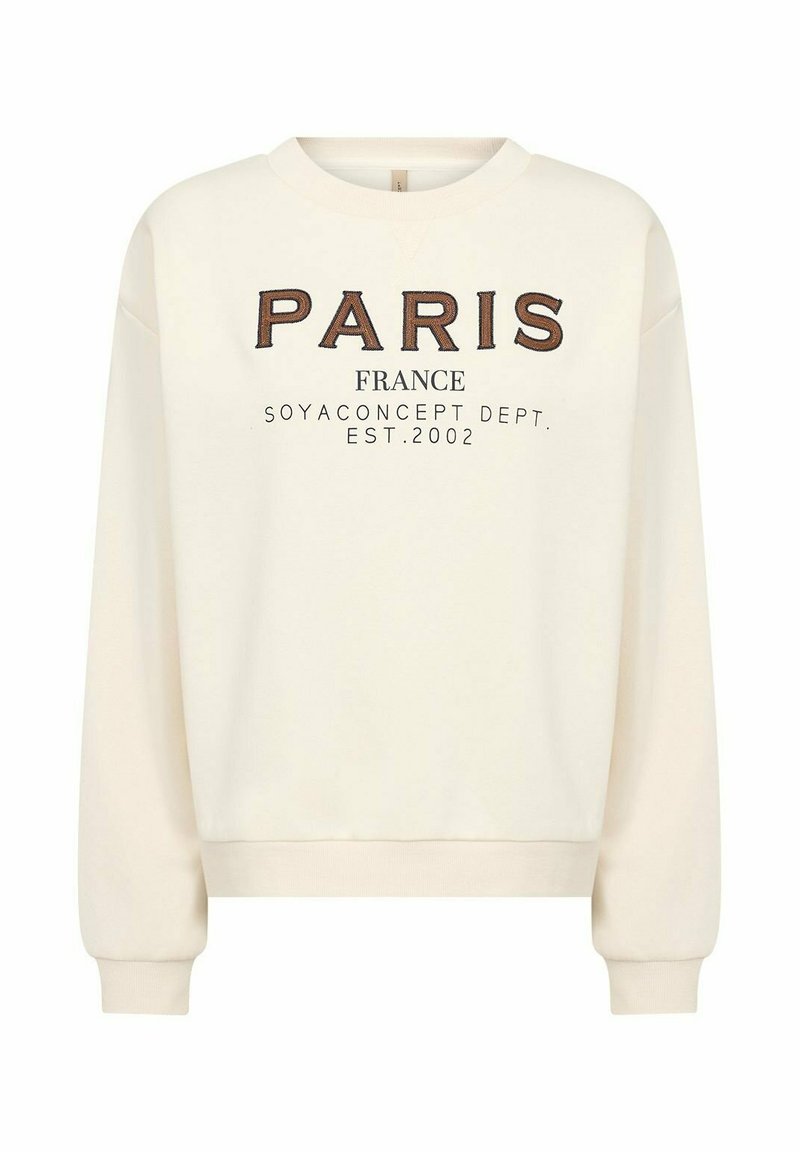 Crèmekleurige trui met de tekst "PARIS FRANCE" in bruine en zwarte letters, met geribbelde boorden en zoom, gemaakt van een zachte stof.