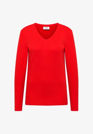 Punainen pitkähihainen V-kaula-aukkoinen t-paita, joka on valmistettu sileästä puuvillakankaasta. Yksinkertainen muotoilu, jossa on merkki kaula-aukon kohdalla. Ei kuvioita eikä korostuksia.