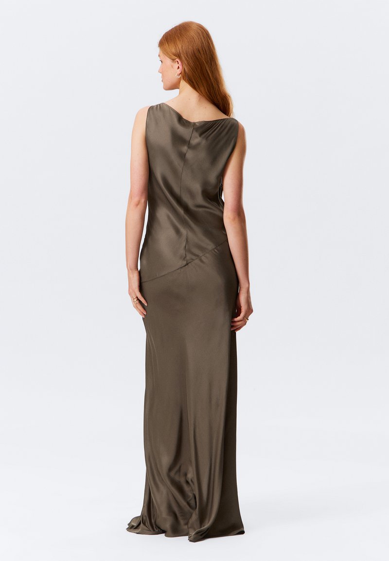 Long, olive green satin dress with a sleek design; features a one-shoulder neckline and flowing silhouette, highlighting a smooth texture.