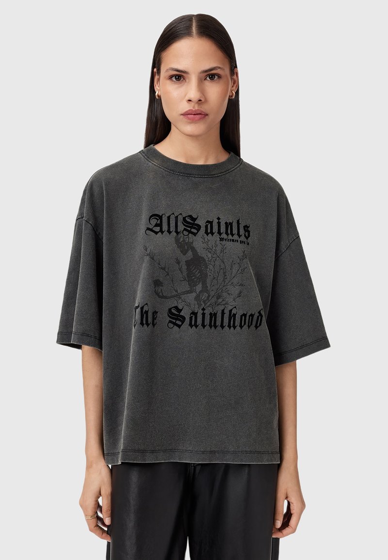 T-shirt grigia oversize realizzata in morbido tessuto, con stampa grafica nera, scollatura rotonda e maniche corte.