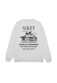 Felpa grigia con un design grafico nero sul retro, che mostra "OBEY" e "HOUSE OF SUBVERSION" con i nomi delle città in caratteri grassetto.
