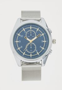 Silver-tone chronograph watch with a blue dial, gold accents, mesh band, and three sub-dials for timekeeping features.