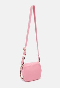 Pink crossbody bag with a padded design, adjustable strap, gold hardware accents, and a chain detail. Smooth texture and compact shape.