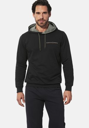 Schwarzer Kapuzenpullover mit einem hellgrünen Innenfutter, ausgestattet mit verstellbaren Kordeln, einem Logo auf der Brust sowie gerippten Bündchen und Saum für einen engen Sitz.