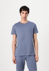 Tommy Jeans - TJM SLIM S FLAG  - Tracksuit bottoms - blue moment Thumbnail Image 1