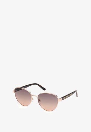 Rose gold metal sunglasses with gradient lenses. Aviator design with a slender frame. Black textured arms featuring gold decorative accents.
